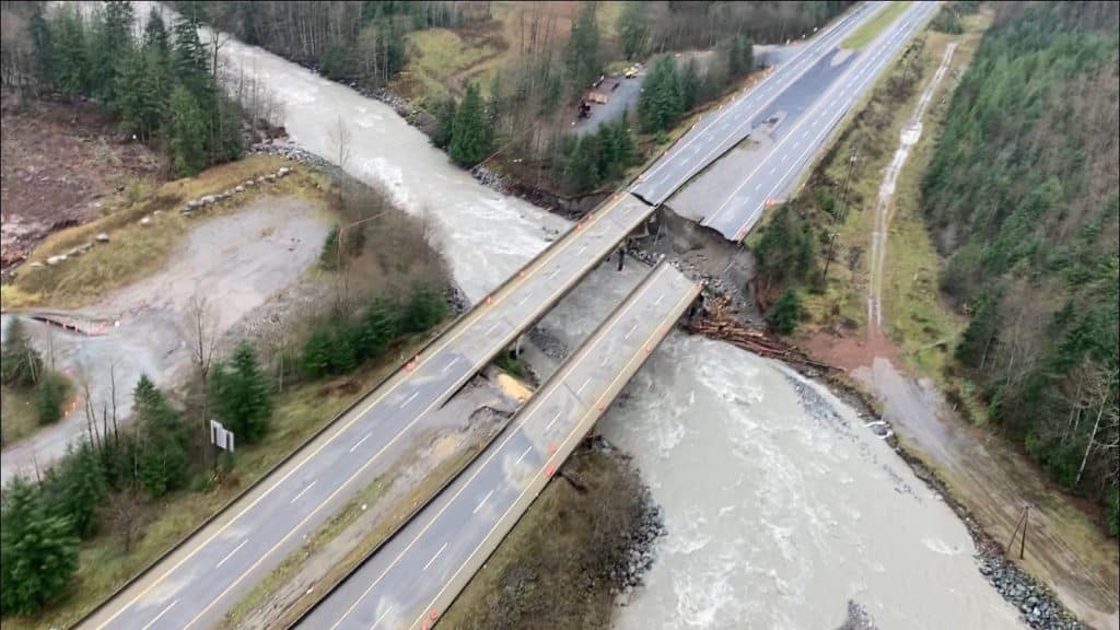 An aerial view of Highway 5 shows a washout that sliced the highway in half.