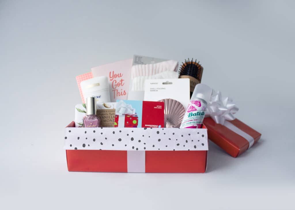 A shoebox from the Kamloops holiday charity drive The Shoebox Project, filled with items like gift cards, nail polish, socks, deodorant and other care items.