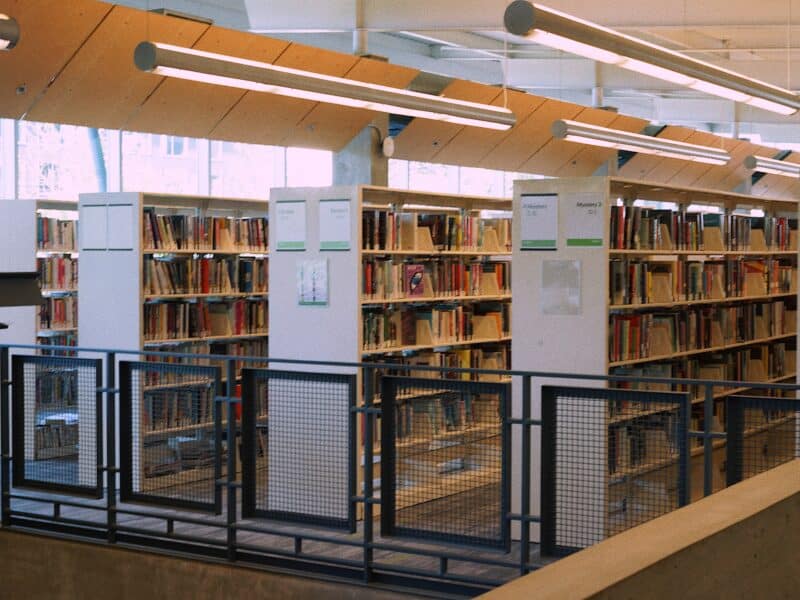 Photo features rows of books upstairs at TNRL