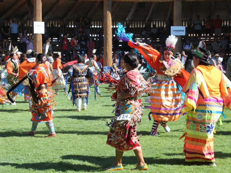 Dancers showcase their orange regalia during a Speaking Our Truth Competition Pow Wow dance special on Sept 9