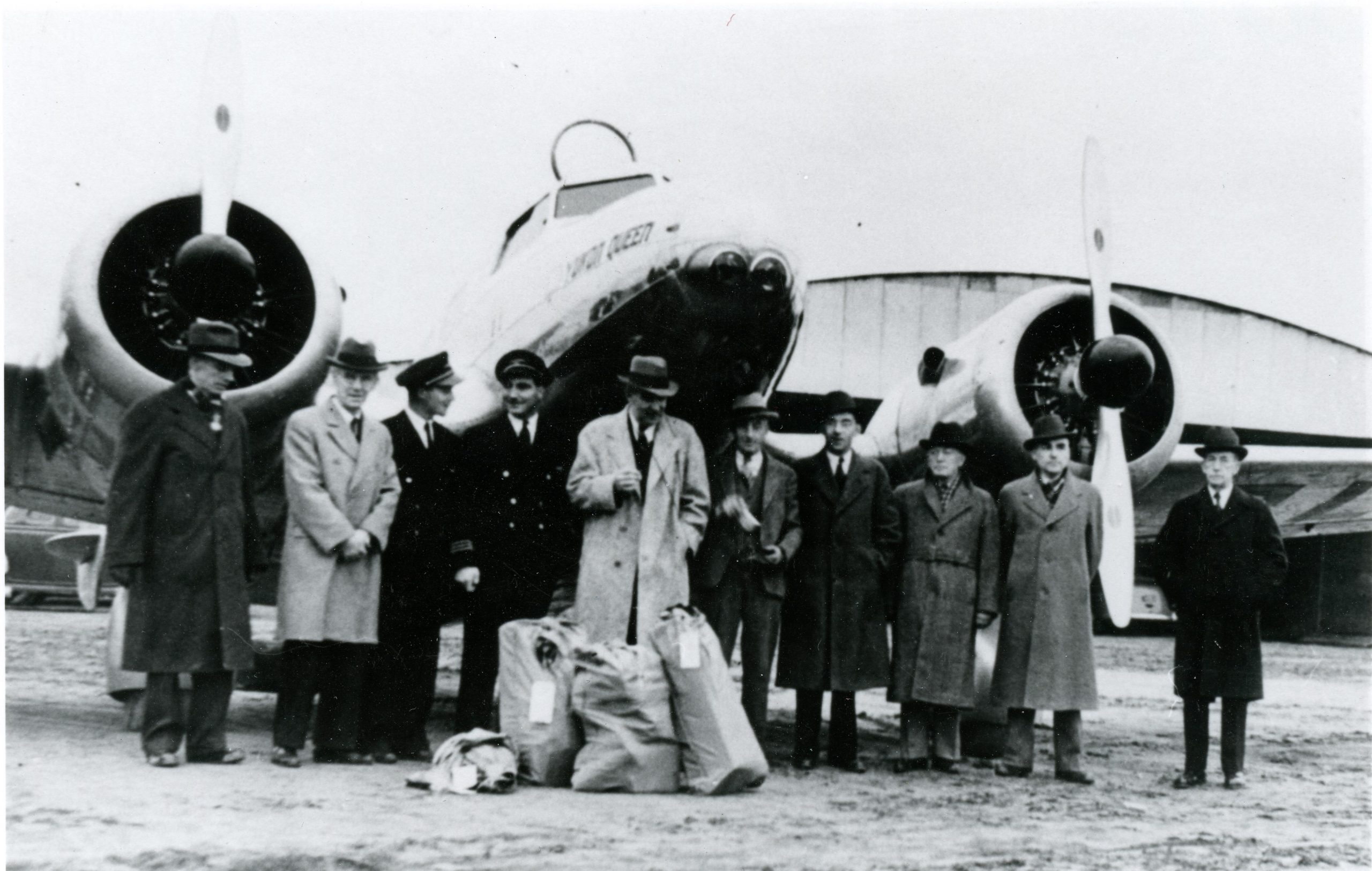 Crew of the “Yukon Queen” meeting with local dignitaries during the first official landing at Kamloops airport, an airmail delivery on April 18, 1939. Photo courtesy of Kamloops Museum and Archives (1509)