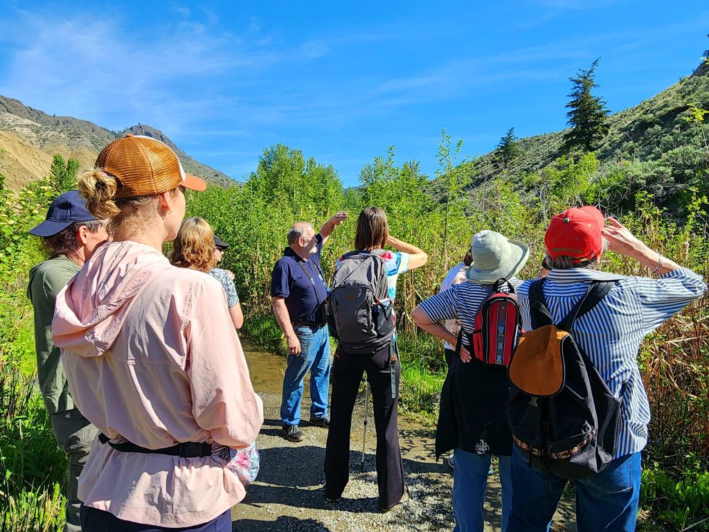 A group of people together who are bird watching and members of the Kamloops Naturalist Club